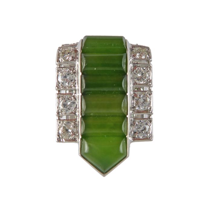 Art Deco petite nephrite and diamond clip brooch by Cartier, the short arrowed form with a central channel of dome-buffed rectangular nephrite, | MasterArt